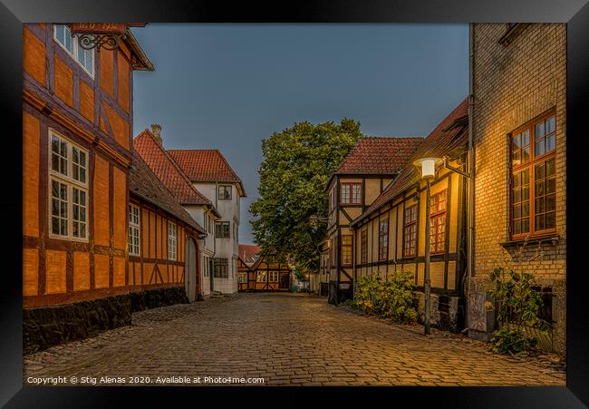 Ancient half-timbered houses at a cobblestone stre Framed Print by Stig Alenäs