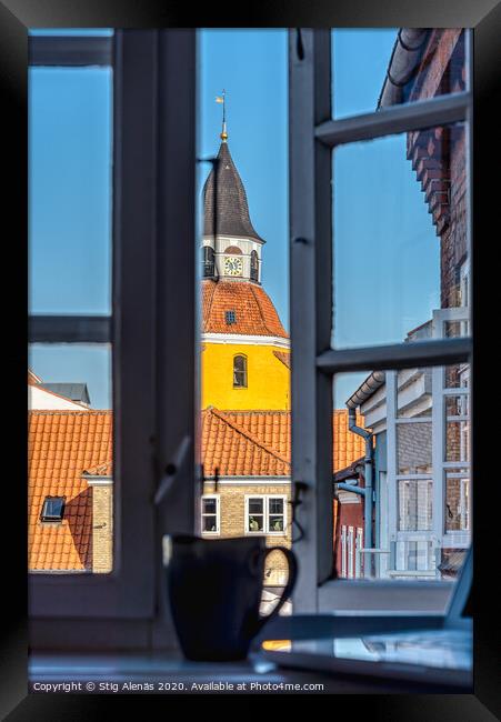 a coffee mug and a laptop in the window frame and a yellow tower Framed Print by Stig Alenäs
