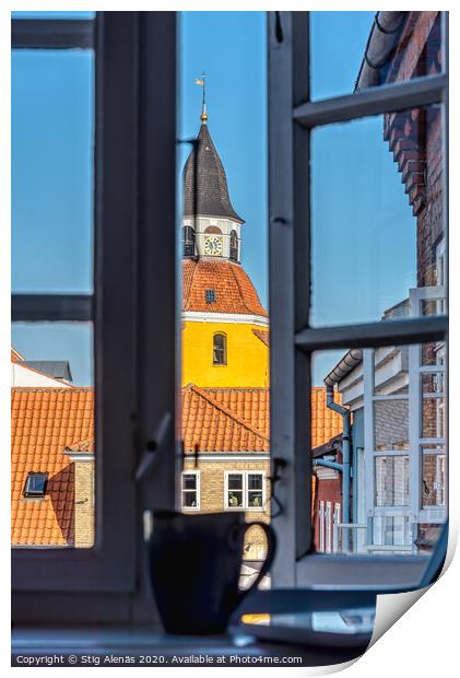 a coffee mug and a laptop in the window frame and a yellow tower Print by Stig Alenäs