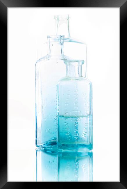 Blue Medicine Bottles Framed Print by Kelly Bailey
