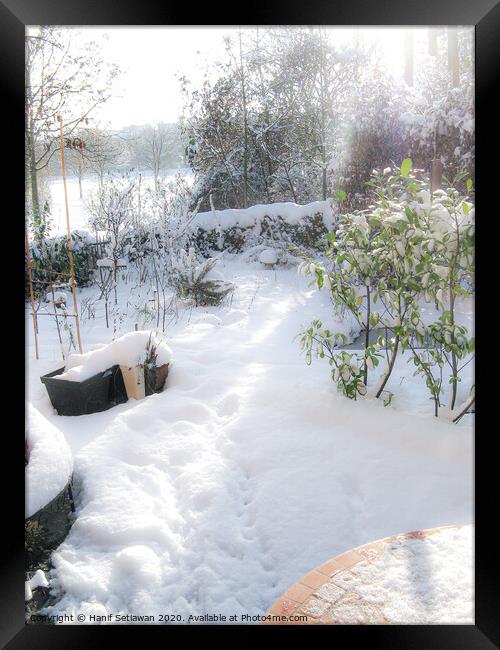 A sunny winter day with fresh snow and footprints  Framed Print by Hanif Setiawan