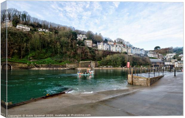 A boat returns up the River Looe in Cornwall Canvas Print by Rosie Spooner