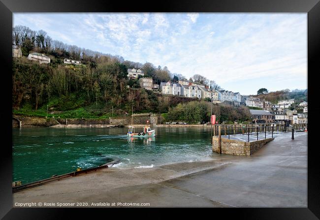 A boat returns up the River Looe in Cornwall Framed Print by Rosie Spooner