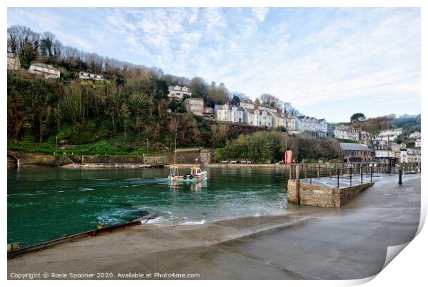 A boat returns up the River Looe in Cornwall Print by Rosie Spooner