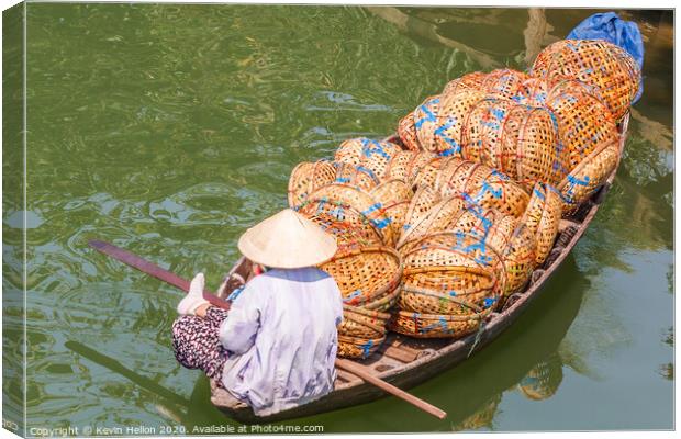 Boat loaded with baskets Canvas Print by Kevin Hellon
