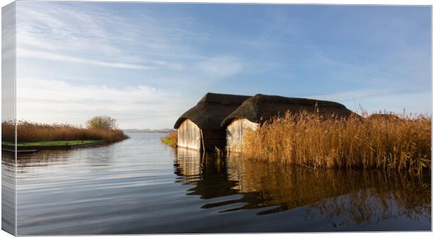 Hickling Boatsheds Canvas Print by Simon Wrigglesworth