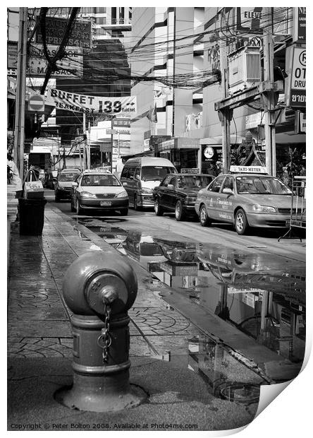 Bangkok street scene in the monsoon season Print by Peter Bolton