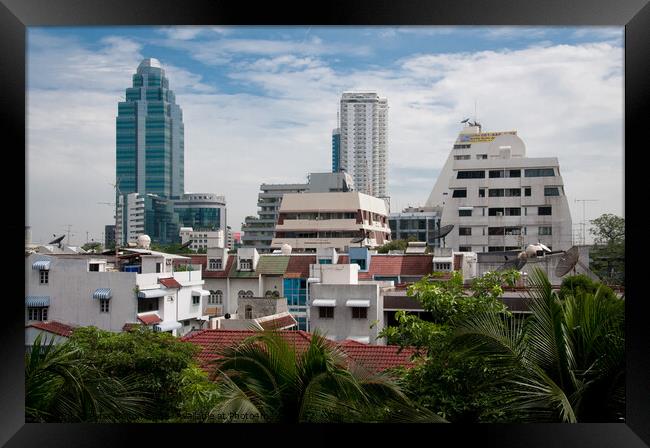 Cityscape of Bangkok, Thailand, showing dwellings and high rise buildings. Framed Print by Peter Bolton