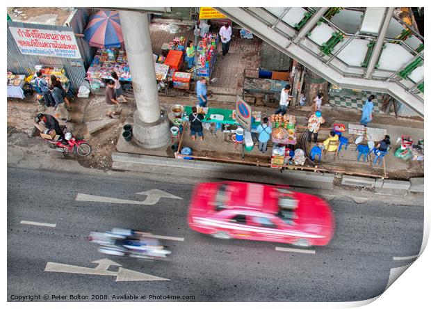 Overhead view of a street with food vendors and traffic speeding past. Bangkok, Thailand. Print by Peter Bolton