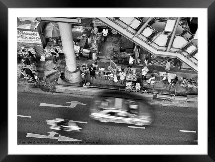Black and white view from overhead of a street with food vendors and traffic. Bangkok, Thailand. Framed Mounted Print by Peter Bolton