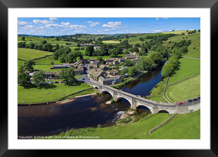 Burnsall Village and the river Wharfe. Framed Mounted Print by Chris North