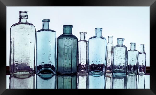 Line of Bottles Framed Print by Kelly Bailey