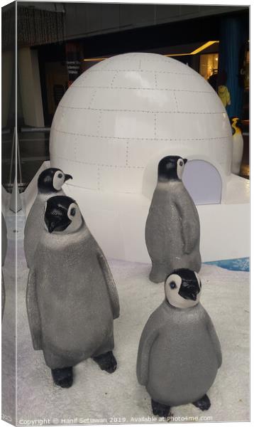 group of Penguin sculptures in front of an igloo 1 Canvas Print by Hanif Setiawan