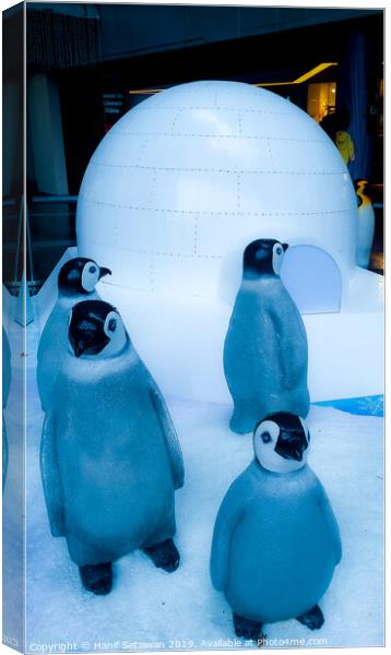 group of Penguin sculptures in front of an igloo 2 Canvas Print by Hanif Setiawan