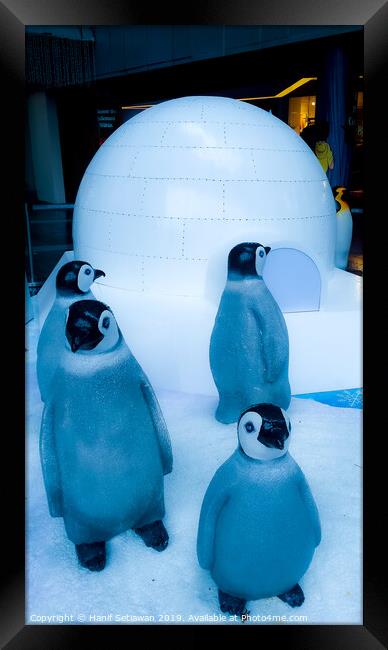 group of Penguin sculptures in front of an igloo 2 Framed Print by Hanif Setiawan