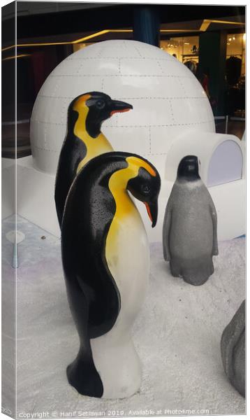 group of Penguin sculptures in front of an igloo 3 Canvas Print by Hanif Setiawan