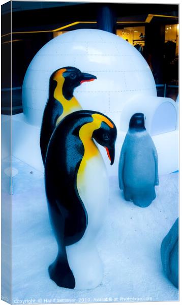 group of Penguin sculptures in front of an igloo 4 Canvas Print by Hanif Setiawan