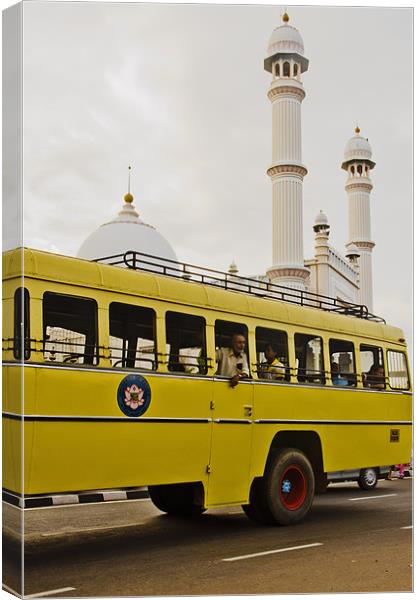 bus and mosque Canvas Print by Hassan Najmy