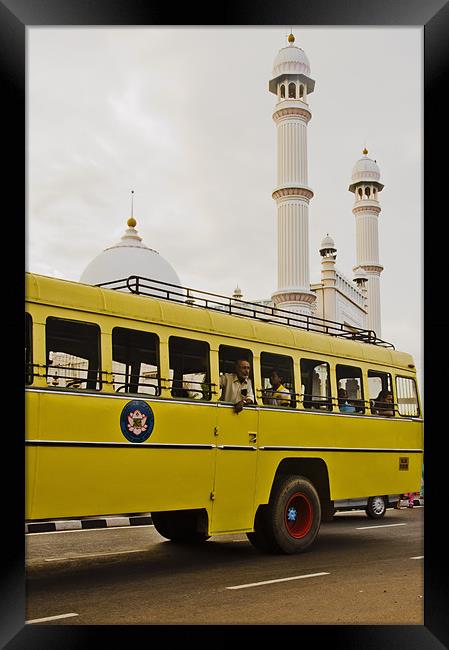 bus and mosque Framed Print by Hassan Najmy