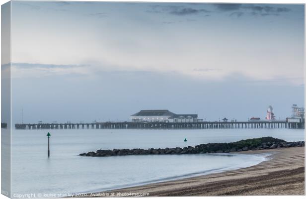 Clacton Pier as the Morning mist clears Canvas Print by louise stanley