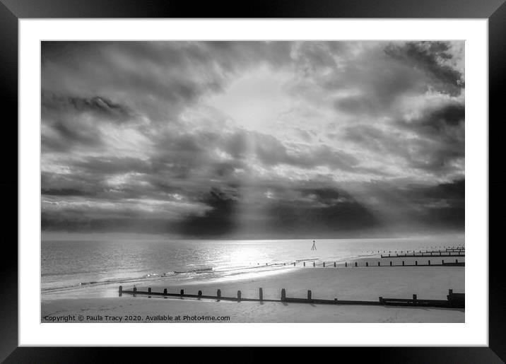 Sun rays streaming through clouds at Frinton beach Framed Mounted Print by Paula Tracy