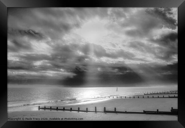 Sun rays streaming through clouds at Frinton beach Framed Print by Paula Tracy