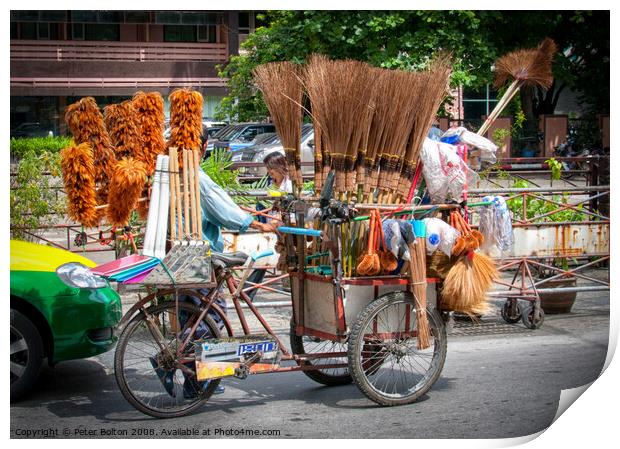 Mobile street vendor selling brushes from a pedal tricycle in central Bangkok. Print by Peter Bolton