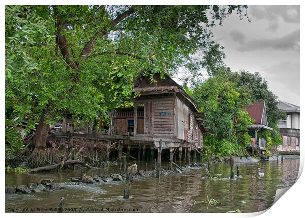 A typical dwelling on one of the canals off the Chao Phraya river, Bangkok. Print by Peter Bolton