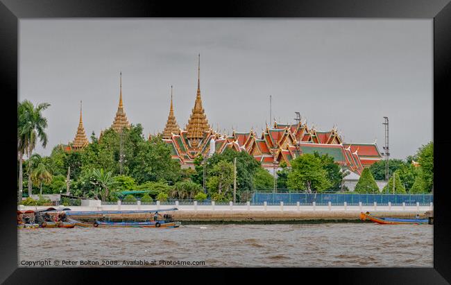 View of The Grand Palace from the Chao Phraya River, Bangkok, Thailand. Framed Print by Peter Bolton
