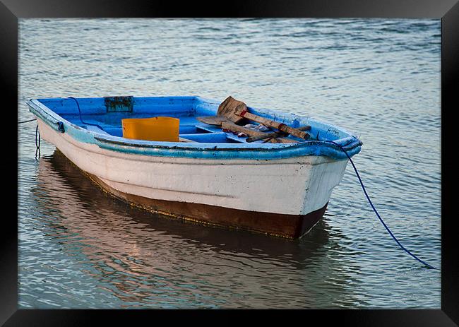 boat resting Framed Print by Hassan Najmy