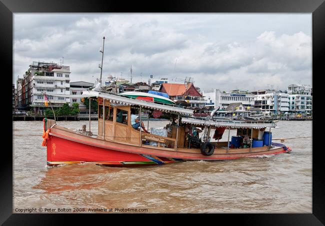 A tourist excursion boat on the Chao Phraya river, Bangkok, Thailand. Framed Print by Peter Bolton