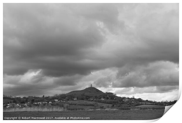 Storm clouds gather over Glastonbury Tor Print by Robert MacDowall