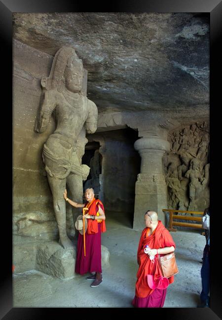 Mumbai, India - October 23, 2018: Interior of a Hindu God sculpture of Elephanta cave, late Gupta dating from between the 9th and 11th centuries, UNESCO World Heritage Site and buddhist monk tourist Framed Print by Arpan Bhatia