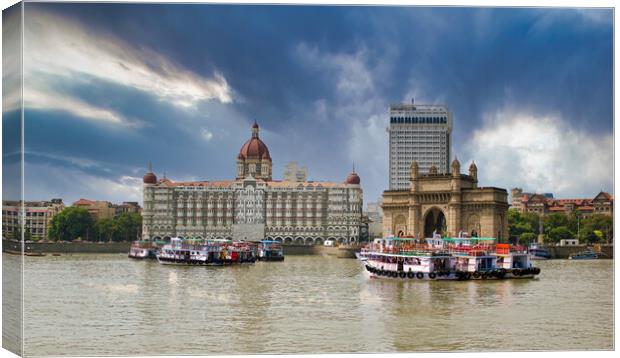 Mumbai, India: Wide angle shot of Gateway of India and Taj hotel against sea and dramatic cloudy sky Canvas Print by Arpan Bhatia