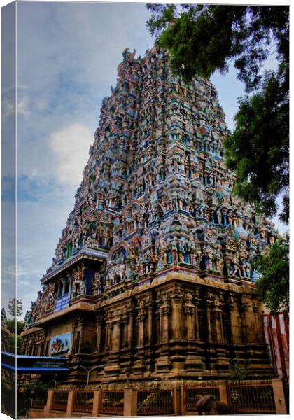 Madurai, South India - November 02, 2018: One of the hindu religious temple amongst many in Meenakshi temple against blue sky Canvas Print by Arpan Bhatia