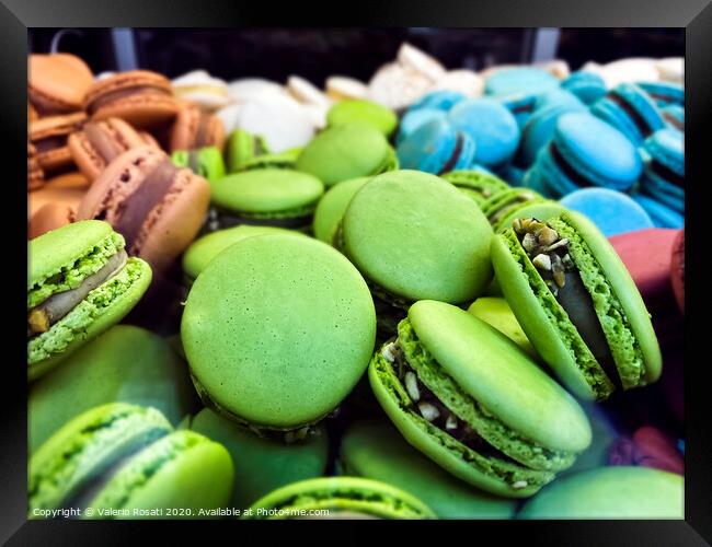 many colorful macarons biscuits arranged disorderly Framed Print by Valerio Rosati