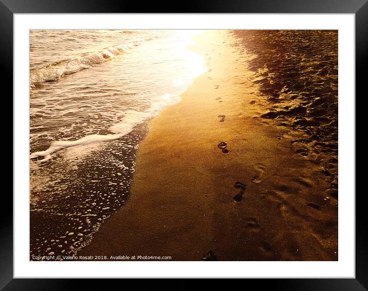 Human footprints on a sandy shoreline Framed Mounted Print by Valerio Rosati