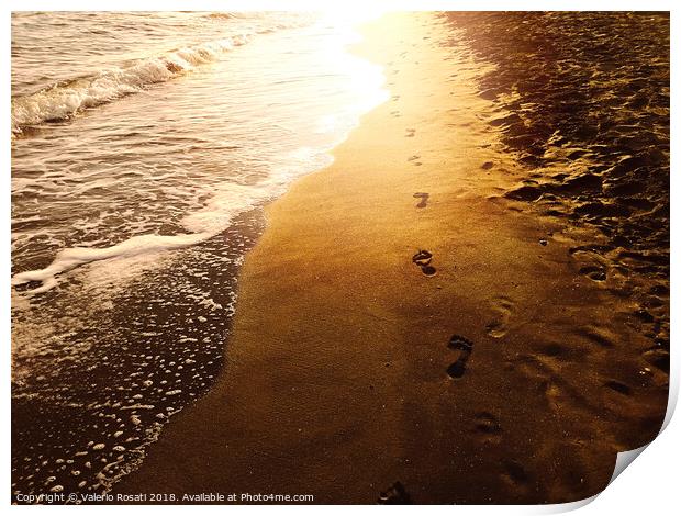 Human footprints on a sandy shoreline Print by Valerio Rosati