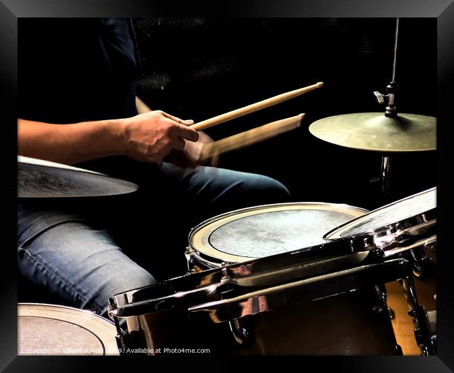 a drummer while playing the drums Framed Print by Valerio Rosati