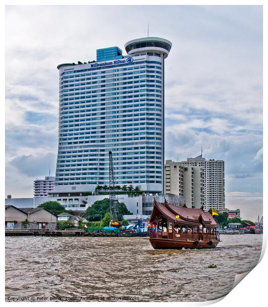 A tourist 'junk' on The Chao Phraya River passes the Millennium Hilton Hotel in Bangkok, Thailand. Print by Peter Bolton