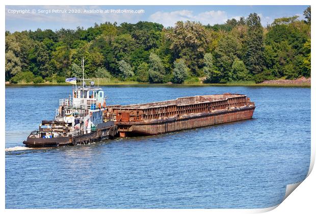 A river tugboat with an empty rusty barge goes crosses a wide river. Print by Sergii Petruk