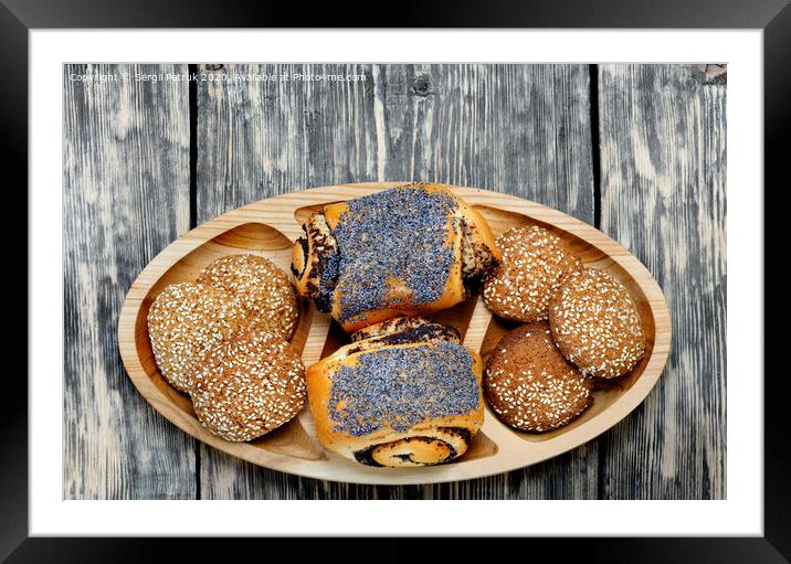 Homemade rolls with poppy seeds and oatmeal cookies with sesame seeds on a wooden tray, top view. Framed Mounted Print by Sergii Petruk