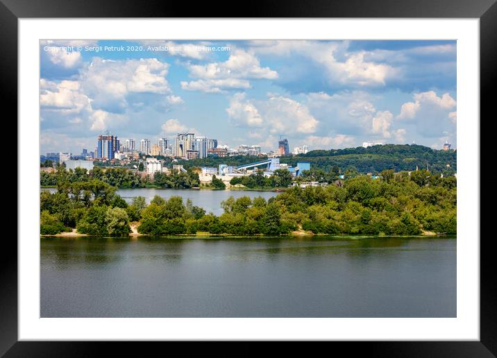 The beautiful cityscape of Kyiv with the Dnipro River and islands in the foreground and new high-rise buildings on the horizon. Framed Mounted Print by Sergii Petruk