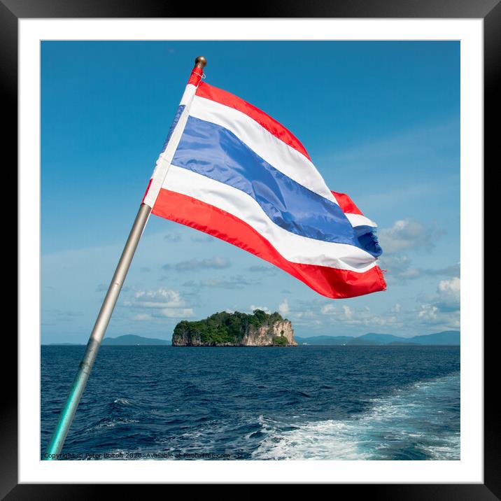 Thailand national flag flying from the stern of a boat. Phang Nga Bay, Thailand. Framed Mounted Print by Peter Bolton