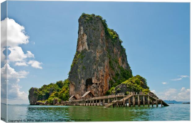 Limestone outcrop with landing stage. Phi Phi Island group, Thailand . Canvas Print by Peter Bolton