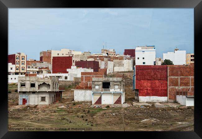 Urban dwellings near Tetoun, Morocco. Framed Print by Peter Bolton
