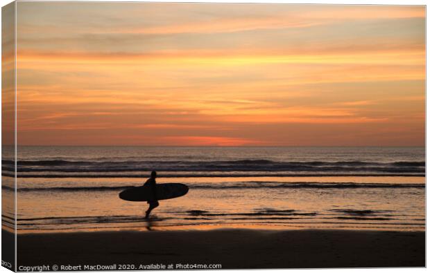 Evening surfer on Piha Beach, New Zealand Canvas Print by Robert MacDowall