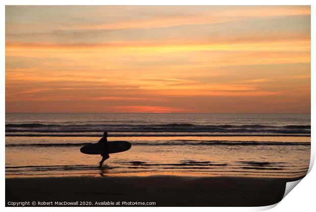 Evening surfer on Piha Beach, New Zealand Print by Robert MacDowall