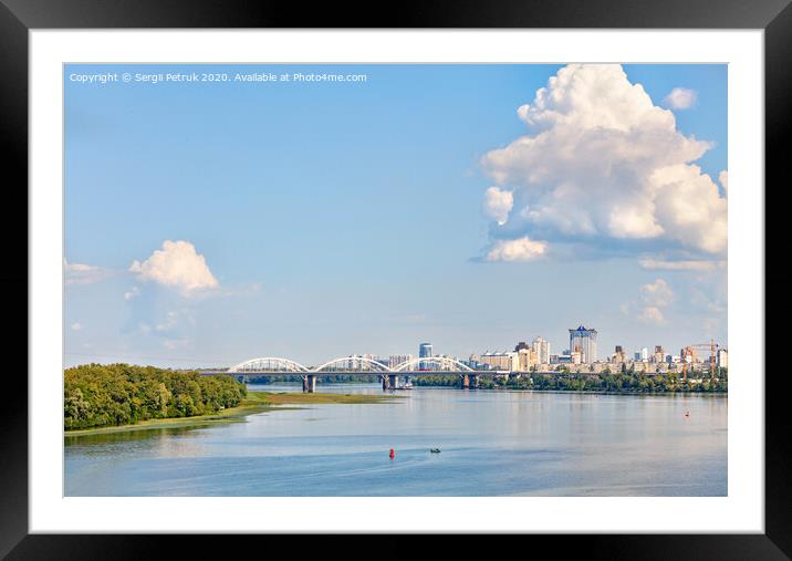 A large figured cloud hung over the city near the railway bridge near the Dnipro River. Framed Mounted Print by Sergii Petruk