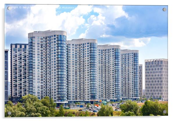 The facades of new residential high-rise buildings against a blue cloudy sky. Acrylic by Sergii Petruk